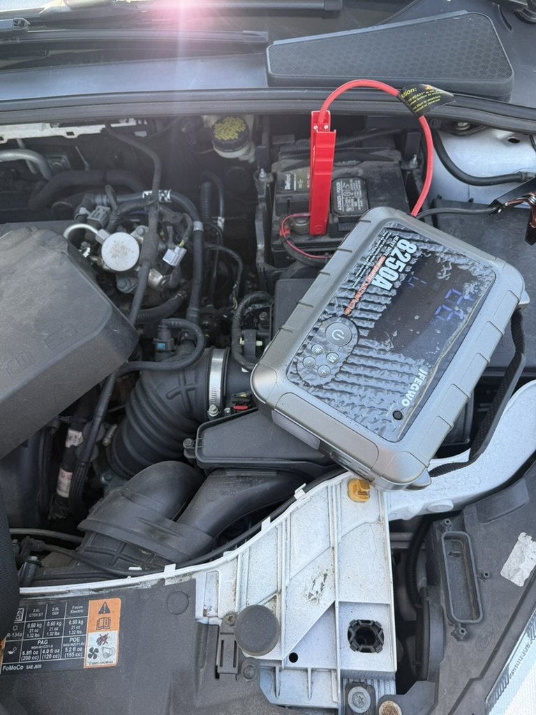Vehicle battery being tested during a mobile Auto Tools Mart service visit