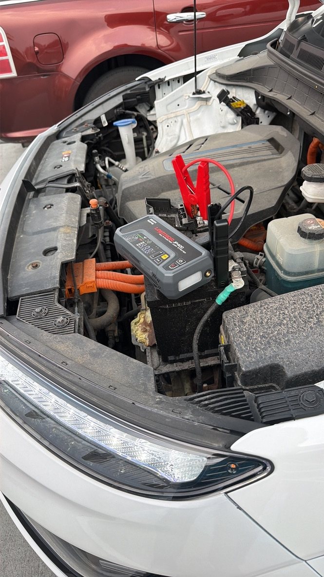 Portable jump starter connected during a mobile Auto Tools Mart service visit