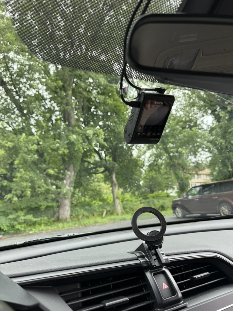 VIOFO dash cam mounted at a windshield with visible cable routing