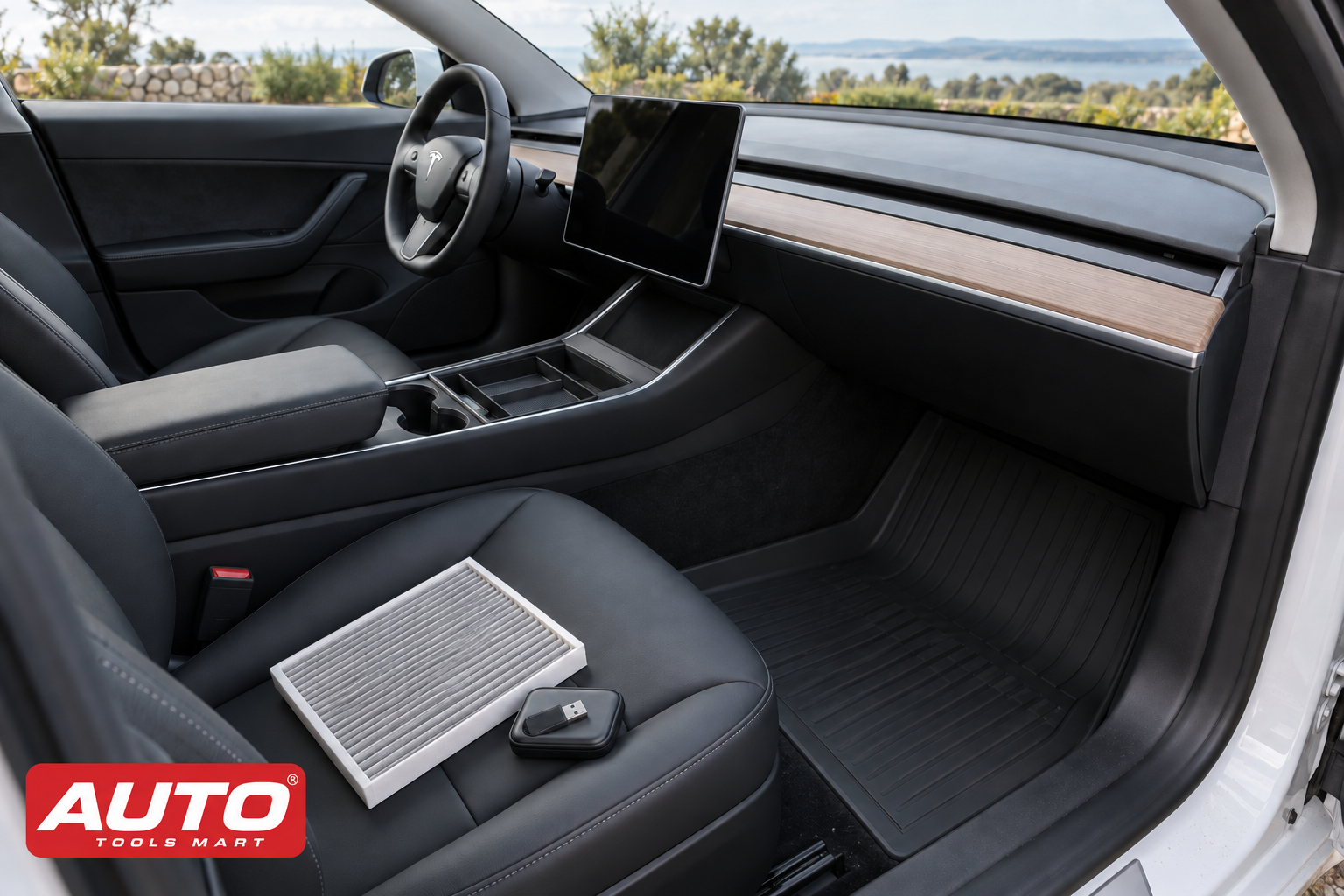 Illustration of a Tesla interior with a cabin filter, USB drive, console organiser and floor mat, with the Auto Tools Mart logo.