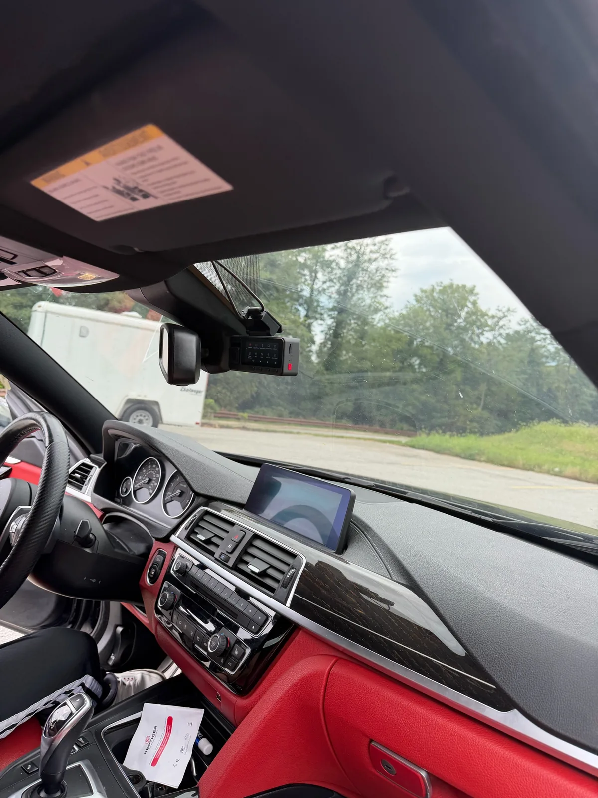Windshield-mounted front dash camera inside a 2019 BMW 430i Gran Coupe after installation in Glen Burnie