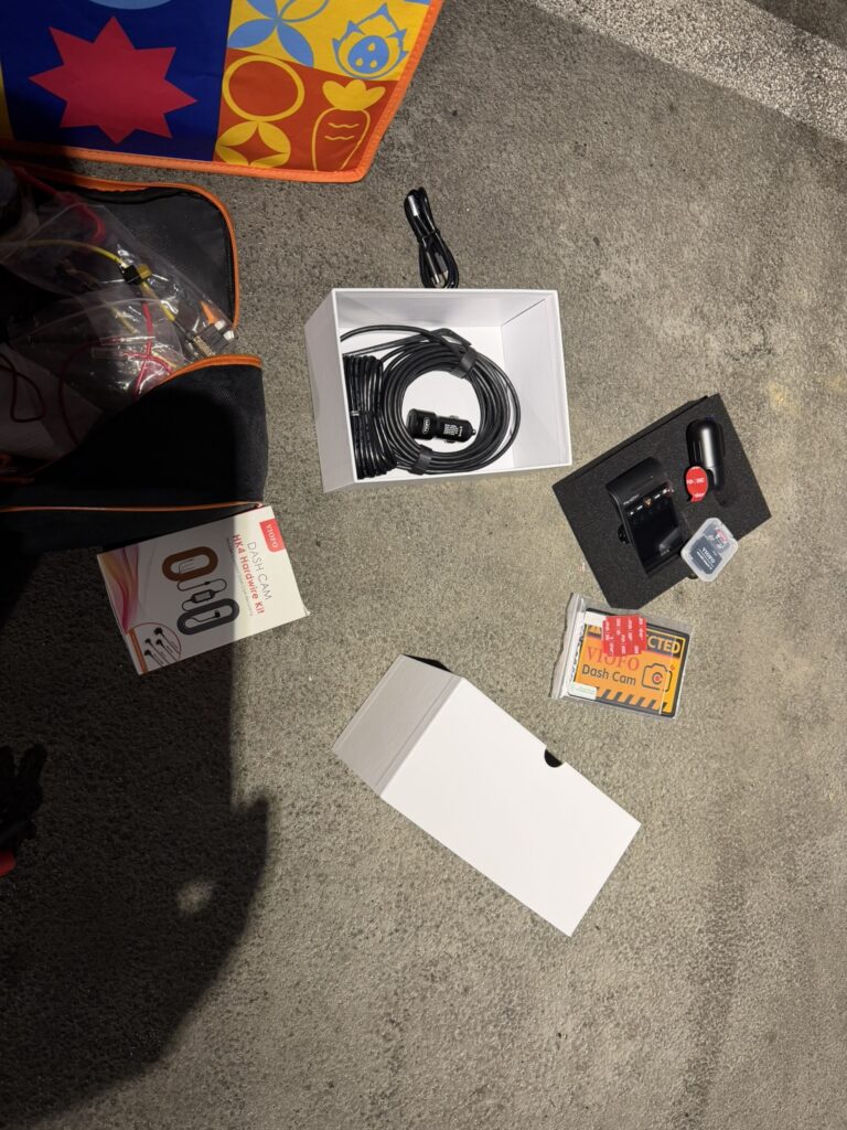 VIOFO front and rear cameras, cables, memory card case and HK4 hardwire kit box laid out for installation.